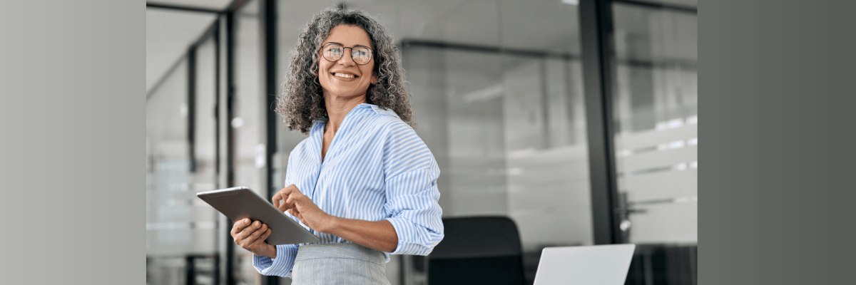 Atractive, mature woman using mortgage payment calculator