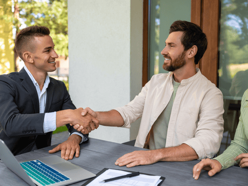Couple learning that they qualify for 1% conventional with 2% first-time home-buyer grant