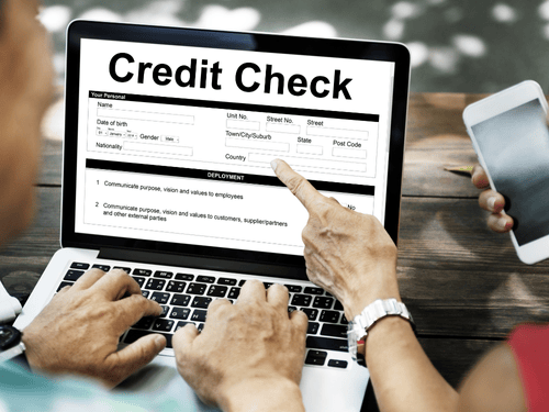 A person checking their credit on their laptop