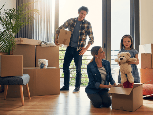 Young family moving into their new house.